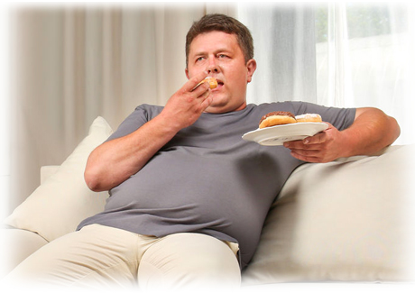 imagen de una persona obesa tomando varios dulces y pasteles